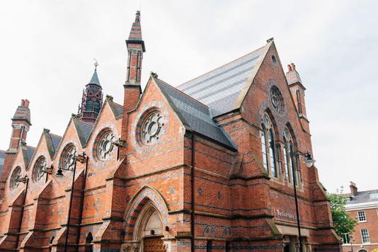 Low angle looking up at the Graduate school building at QUB